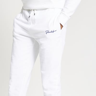 white slim joggers