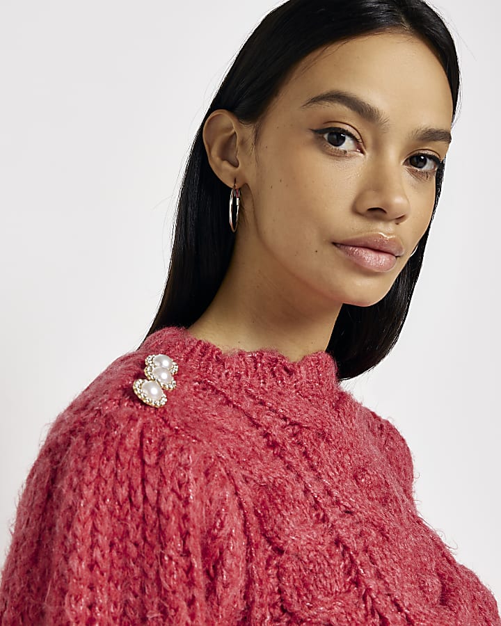 Red cable knit jumper