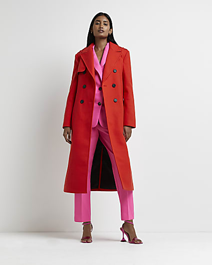 Red double breasted belted trench coat