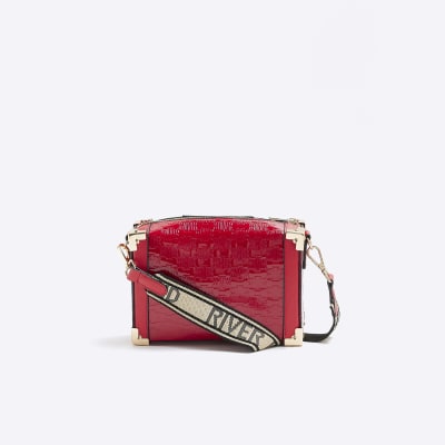 Red embossed trunk bag River Island