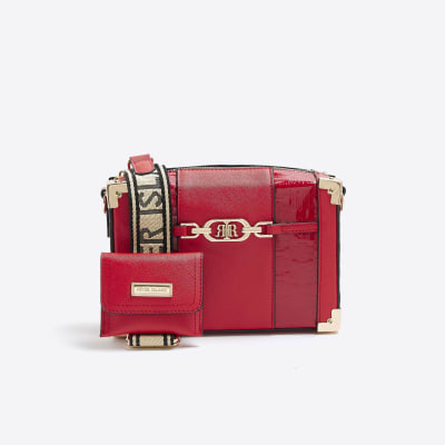 Red embossed trunk bag River Island