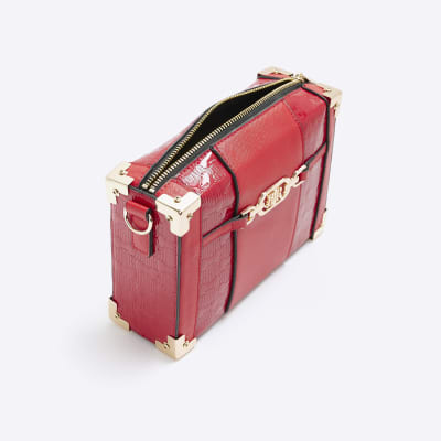 Red embossed trunk bag River Island