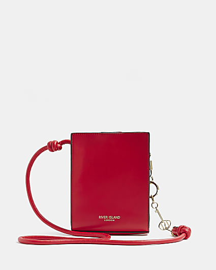 Red faux leather cross body bag