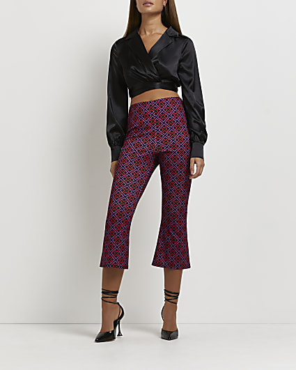 Red geometric print cropped flared trousers