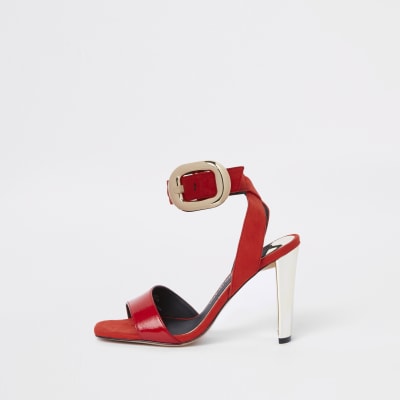 Red oversized gold tone buckle sandal