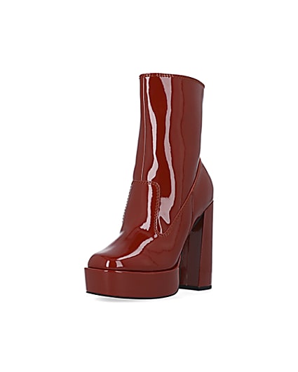 360 degree animation of product Red patent platform heeled ankle boots frame-0