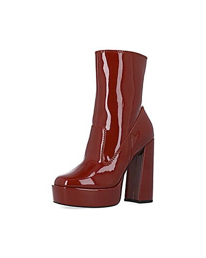 360 degree animation of product Red patent platform heeled ankle boots frame-1