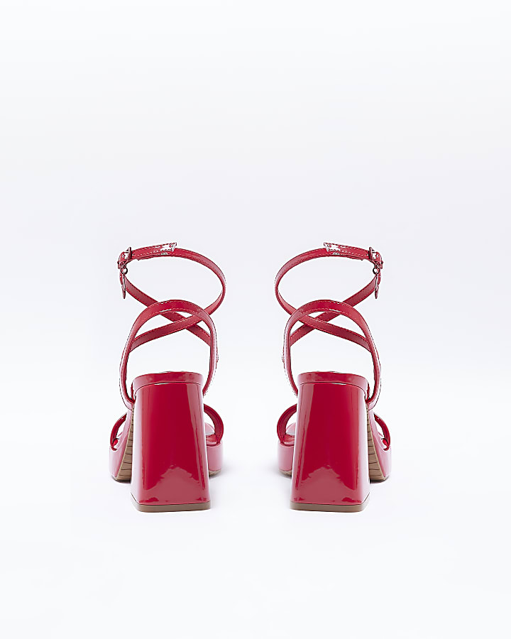 Red patent platform heeled sandals