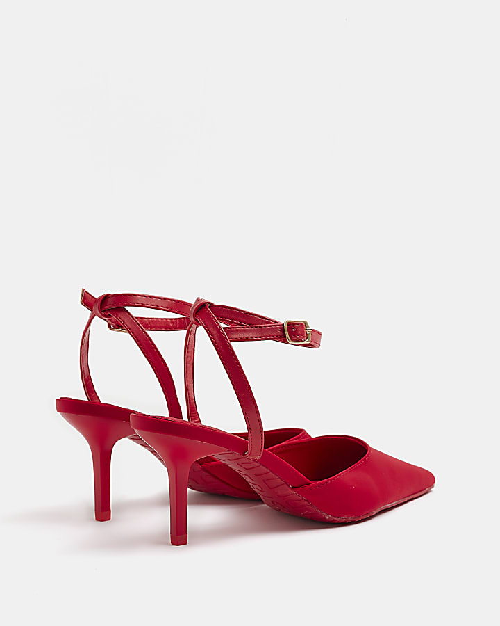 Red pointed heeled court shoes