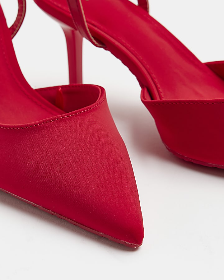 Red pointed heeled court shoes