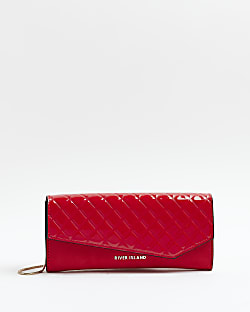 Red quilted asymmetric clutch bag