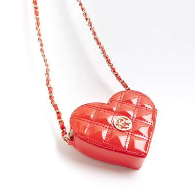 Red quilted heart cross body bag River Island