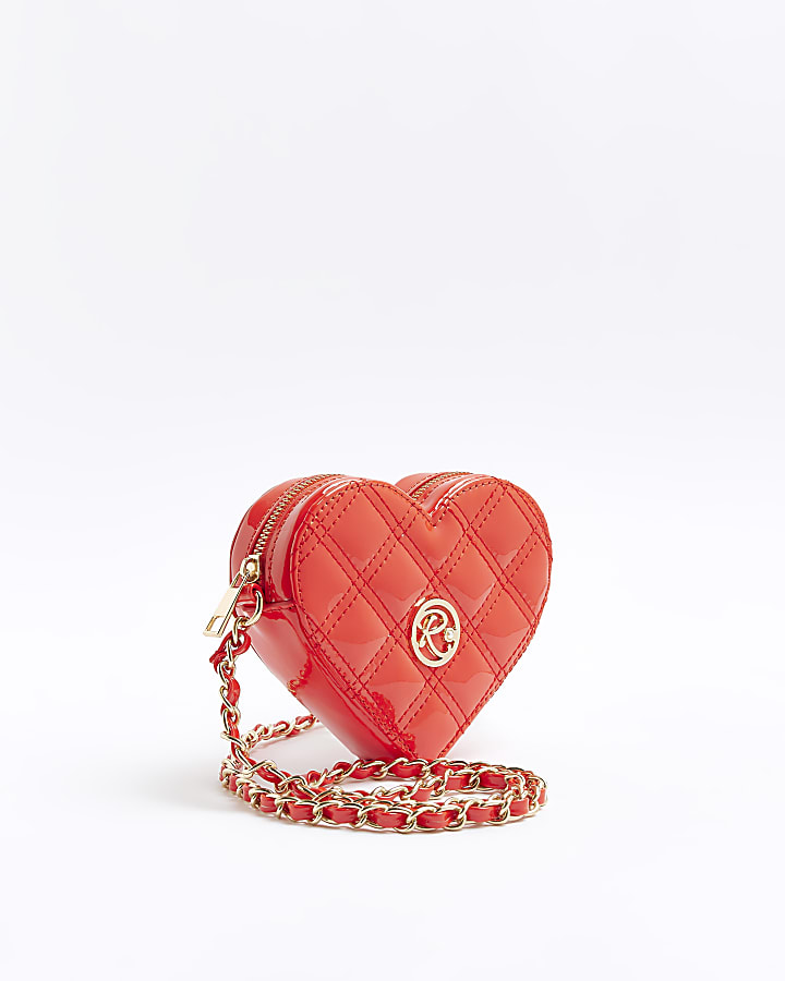 Red quilted heart cross body bag | River Island