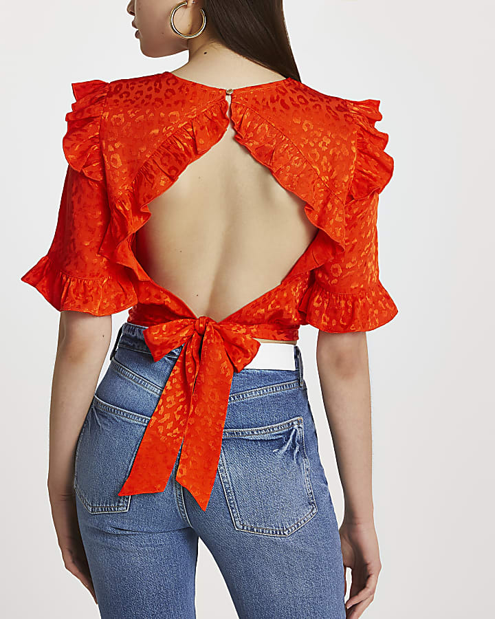 Red short sleeve open back frill top
