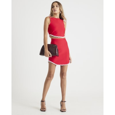 Red sleeveless embellished crop top