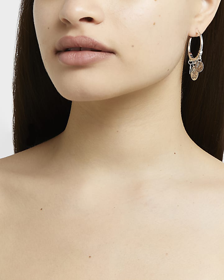 Silver diamante coin pendant drop earrings