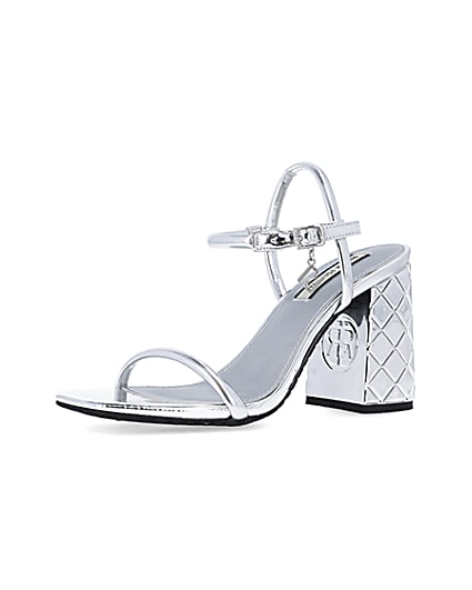 360 degree animation of product Silver embossed heeled strappy sandals frame-1