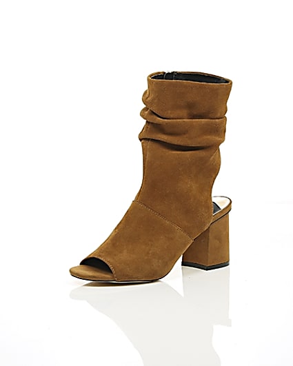 360 degree animation of product Tan suede slouch shoe boots frame-0