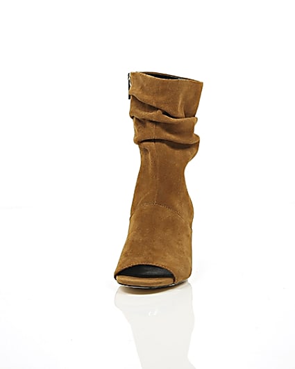 360 degree animation of product Tan suede slouch shoe boots frame-3