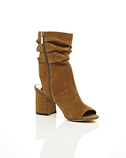 360 degree animation of product Tan suede slouch shoe boots frame-7