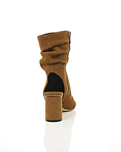 360 degree animation of product Tan suede slouch shoe boots frame-15