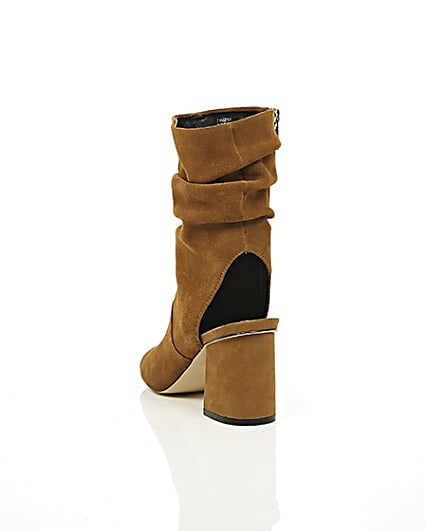360 degree animation of product Tan suede slouch shoe boots frame-17