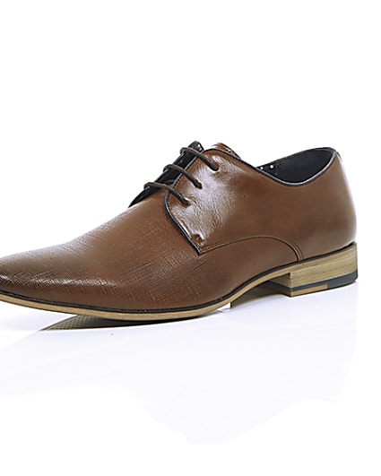 360 degree animation of product Tan textured lace-up formal shoes frame-0