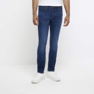 Washed dark blue skinny fit jeans | River Island