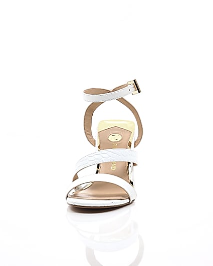 360 degree animation of product White asymmetric strappy block heel sandals frame-3