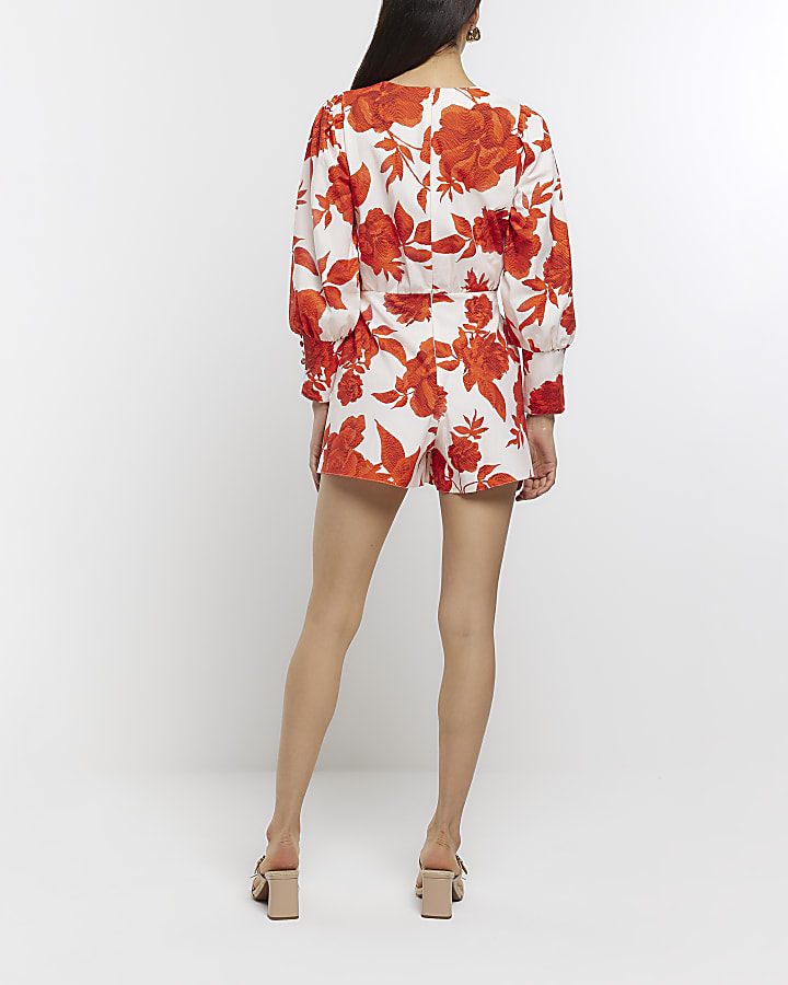 White belted floral long sleeve playsuit