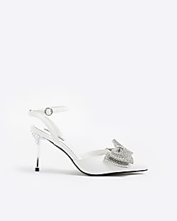 White bow heeled court shoes