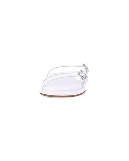 360 degree animation of product White buckle detail flat sandals frame-21