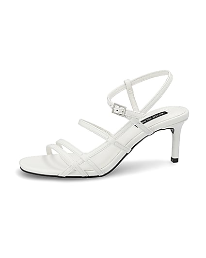 360 degree animation of product White caged skinny heel sandals frame-2