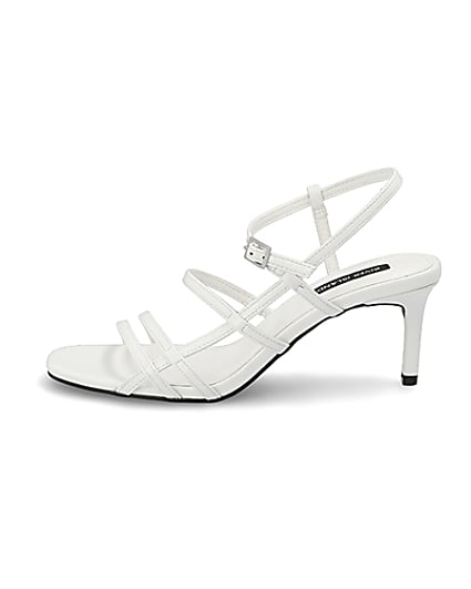 360 degree animation of product White caged skinny heel sandals frame-3