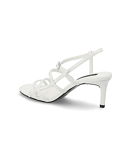 360 degree animation of product White caged skinny heel sandals frame-5