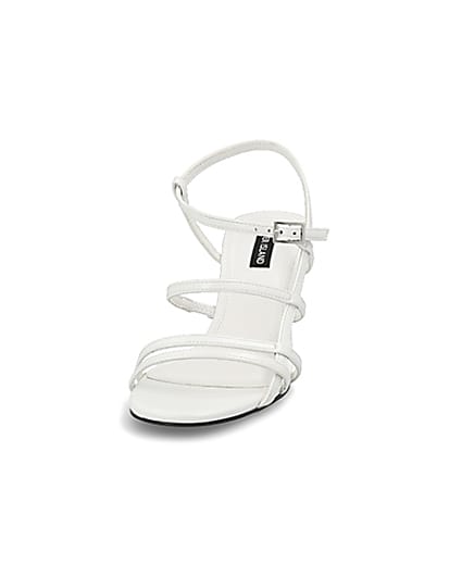 360 degree animation of product White caged skinny heel sandals frame-22