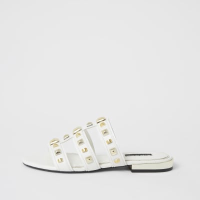 white flat mule slides