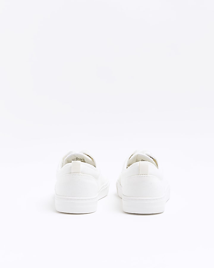 White canvas lace up trainers