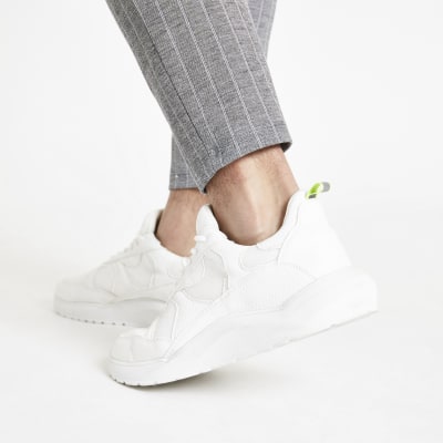 White chunky sole lace-up trainers