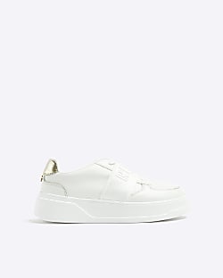 White elastic river branded trainers