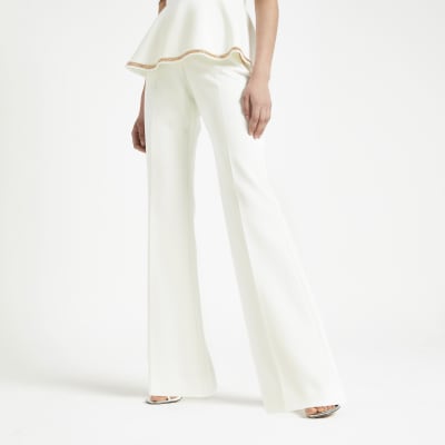 White embellished wide leg trousers