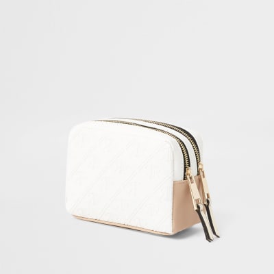 White embossed make-up bag