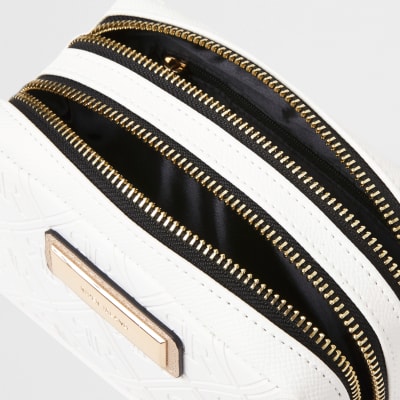 White embossed make-up bag