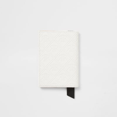 White embossed passport holder