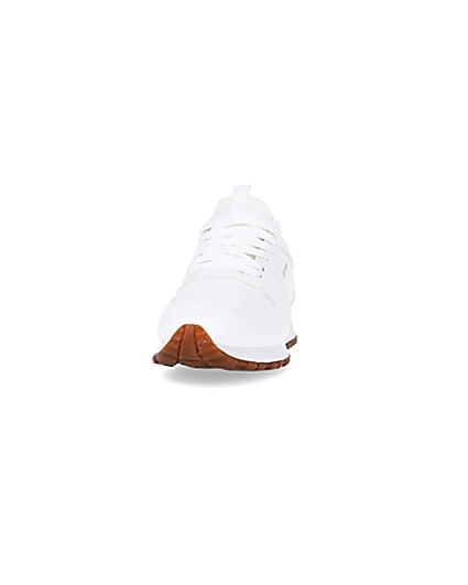 360 degree animation of product White embossed runner trainers frame-22