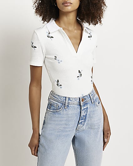 White embroidered floral knit top