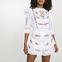 White embroidered frill sleeve top
