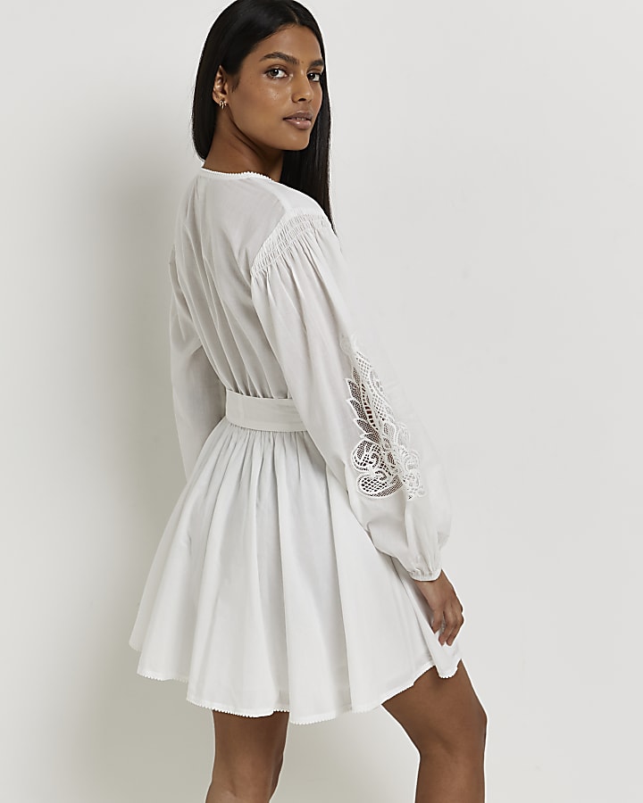 White embroidered wrap mini dress