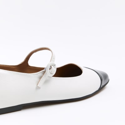White flat ballet shoes