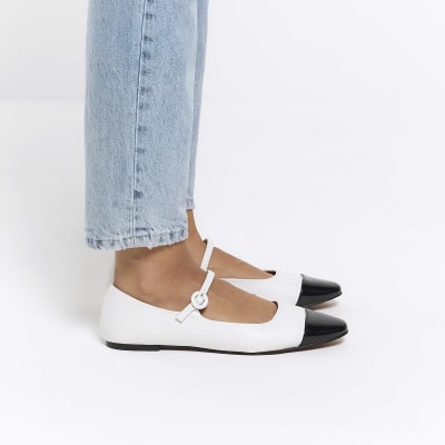 White flat ballet shoes
